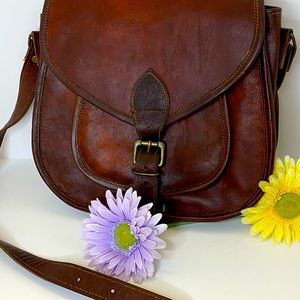 Large brown leather crossbody purse.